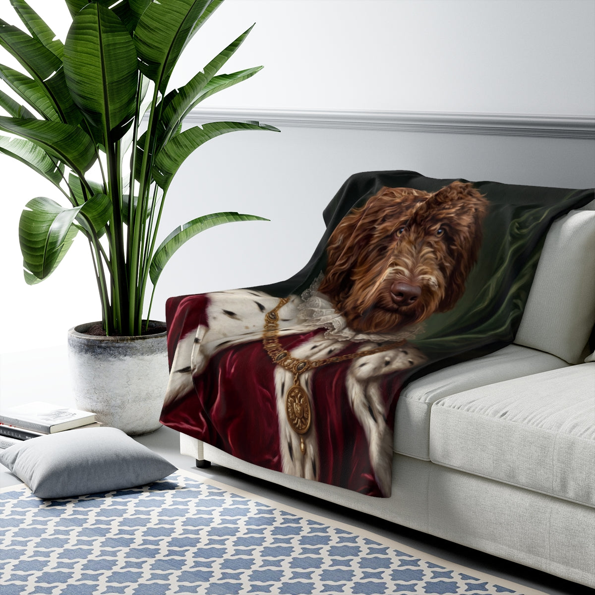 Pawstocrat sherpa blanket with a royal dog portrait, draped on a sofa